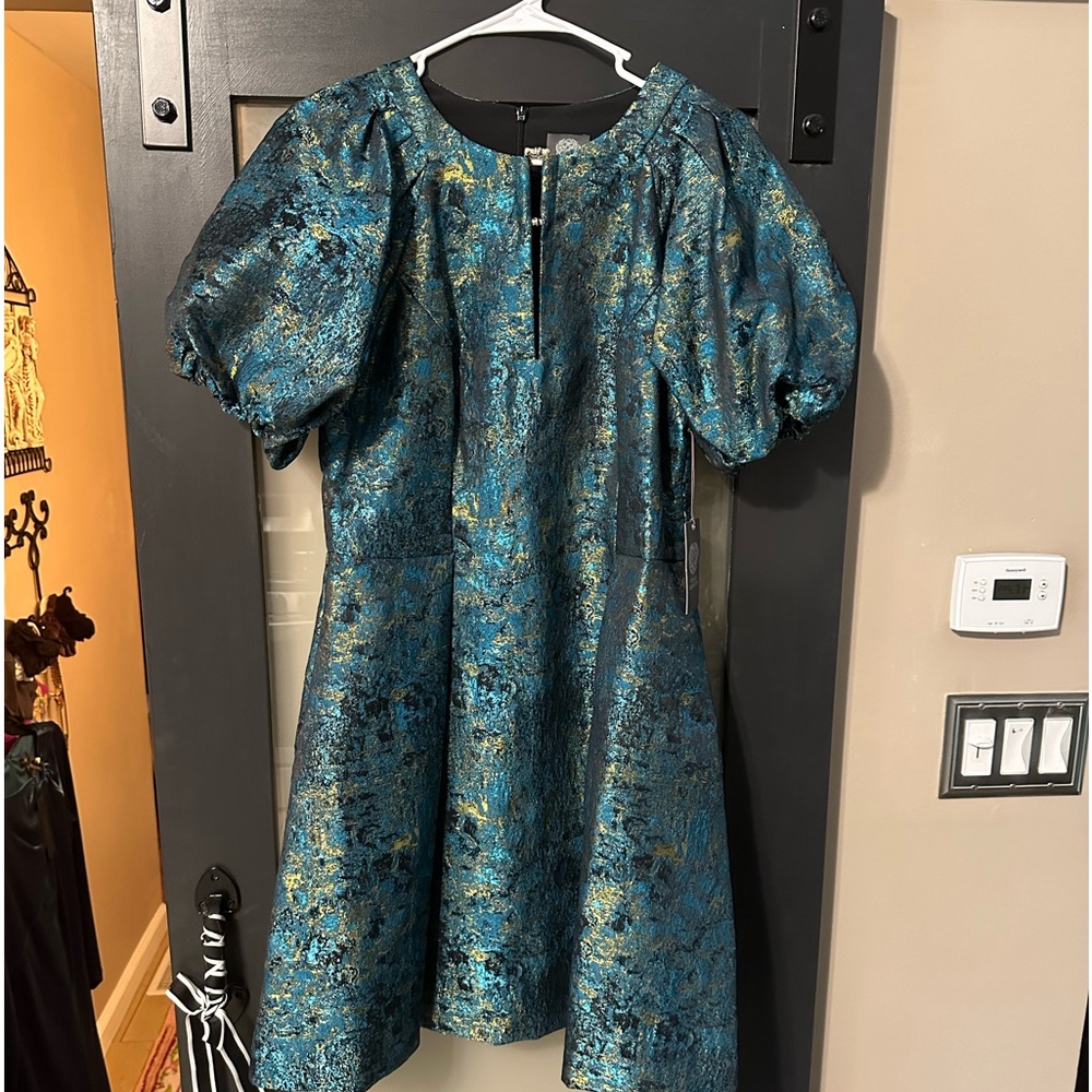 Vince Camuto party dress size 12, but fits more like a size 6 to 8. Runs small.